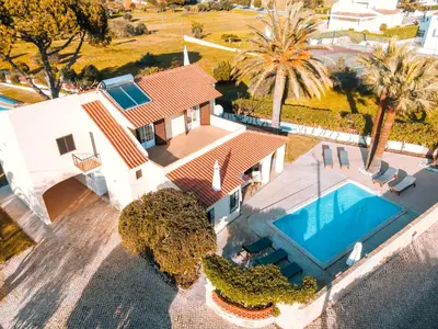 an aerial view of a house with a swimming pool at Villa Angélica - Cozy Homestay in Albufeira