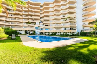 an apartment with a swimming pool in front of a building at Varandas do Sol by Garvetur in Vilamoura