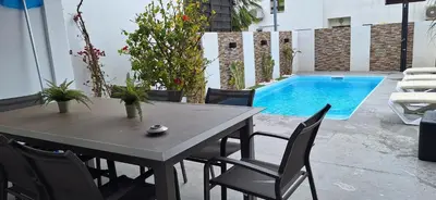a table and chairs sitting on a patio at Casinha do sul- Private pool in Albufeira