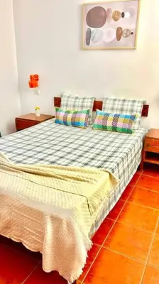 a bed with two pillows in a bedroom at Resort Albufeira T1, Praia da Oura in Albufeira
