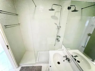 a bathroom with a shower and a sink at Apartamento 5 Estrelas Praia da Oura in Albufeira