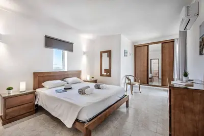 a bedroom with a large bed in a room at Villa Tilia in Galé