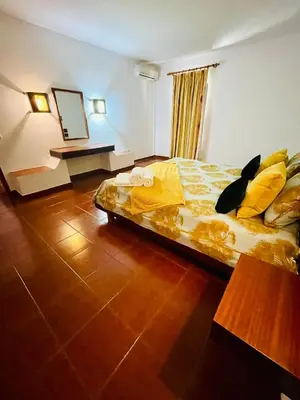 a hotel room with a bed and a mirror at Resort Albufeira T1, Praia da Oura in Albufeira