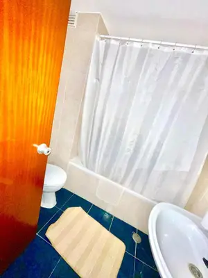 a bathroom with a tub and a toilet and a sink at Resort Albufeira T1, Praia da Oura in Albufeira