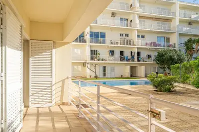 a view from the balcony of a building with a swimming pool at Blue Horizon Apartment by HelloVacations in Albufeira