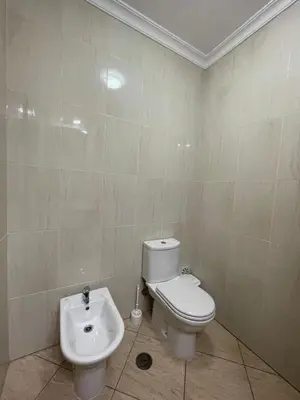 a bathroom with a toilet and a sink at Invited to Albufeira in Guia