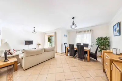 a living room with a couch and a table at Villa Astro in Albufeira