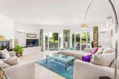 a backyard with a swimming pool and a house at Villa Sunset Golf in Vilamoura