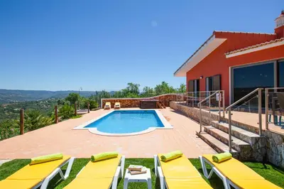 a villa with a swimming pool and a house at Casa Salir in Salir
