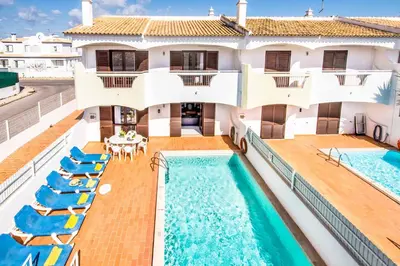 an image of a house with a swimming pool at Villa Canto in Albufeira