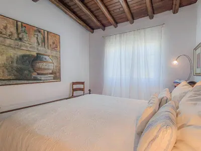 a bedroom with a large white bed with a window at Villa Vale de Ursa - 16 - BY BEDZY in Sesmarias