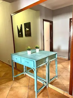 a blue table with two potted plants on top of it at Beautiful Penthouse Two Bed Roof in Albufeira