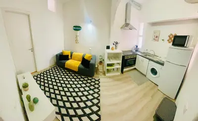 a small living room with a couch and a kitchen at Boutique Two Bedrooms Apartament Praia Da Oura in Albufeira