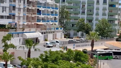 a view of a parking lot in front of a building at NORA Studio in Quarteira