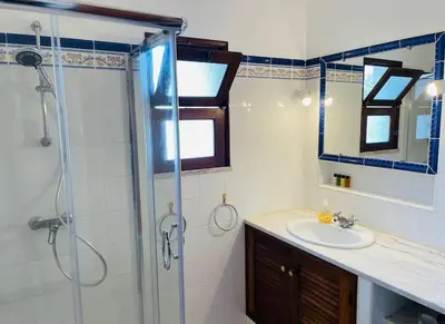 a bathroom with a sink and a shower at Self-contained floor of Quinta / Villa in Guia