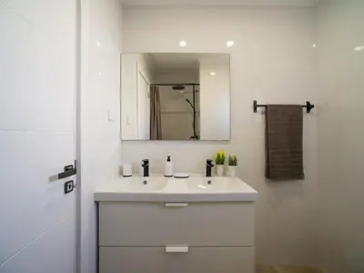 a bedroom with a bed with a hat on it at Holiday Home LY - VIP Properties by Interhome in Albufeira