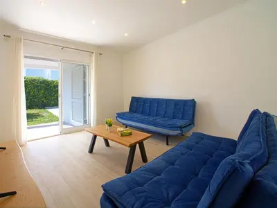 a dining room with a wooden table and chairs at Holiday Home LY - VIP Properties by Interhome in Albufeira