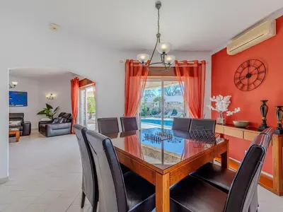 a living room with a couch and a flat screen tv at Holiday Home Paulo - VIP Properties by Interhome in Galé