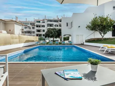 a swimming pool in the backyard of a apartment at Holiday Home Lima - VIP Properties by Interhome in Albufeira