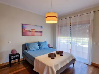 a bedroom with a bed and a large window at Villa Corcovada Lote 28 VIP Properties by Interhome in Albufeira