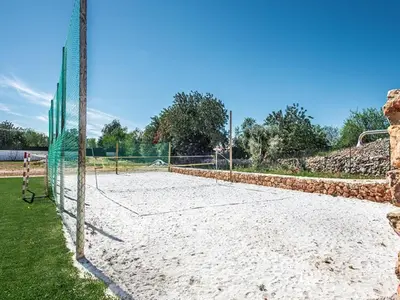 a patio with wicker chairs and a table at Villa Quinta Valente VIP Properties by Interhome in Silves