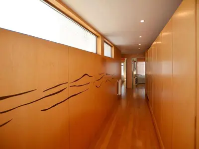a hallway with a wall with writing on it at Special Vilamoura Villa 6 Bedrooms Villa Lagoon Private Pool in Quarteira