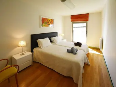 a bedroom with a bed with a stuffed animal on it at Special Vilamoura Villa 6 Bedrooms Villa Lagoon Private Pool in Quarteira