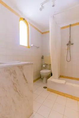 a bathroom with a shower and a toilet at AL - Aldeia do Golfe Retreat in Vilamoura