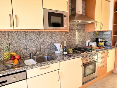 a kitchen with a sink and a stove top oven at AlbufeiraOrada Cozy&Sunny Condo by BeCherish in Albufeira