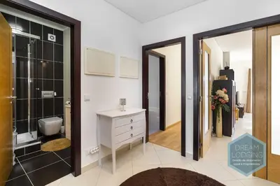 a bathroom with a shower and a sink and a toilet at Miguel Torga - Dream Lodging in Albufeira