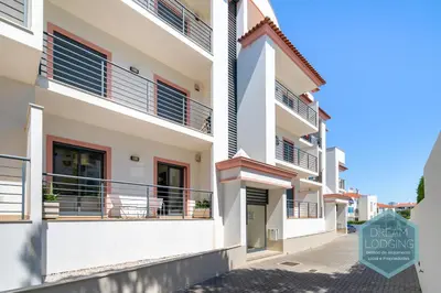 a building with balconies and a sign that reads dream condos at Miguel Torga - Dream Lodging in Albufeira