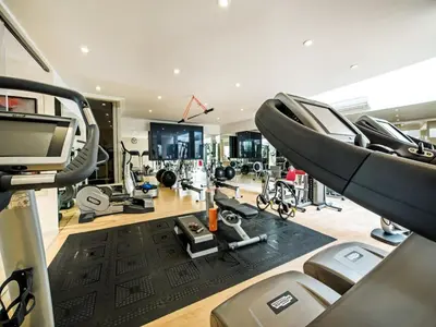 a gym with treadmills and exercise equipment in it at Outstanding Algarve Villa 8 Bedrooms Villa Agua Grande Deluxe Seaviews in Albufeira