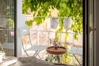a patio with a table and chairs on a balcony at Casa Passion in Faro