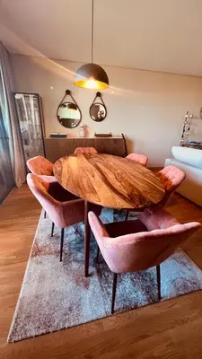 a dining room with a wooden table and chairs at Apartamento T2 novo e espaçoso em Vilamoura in Vilamoura