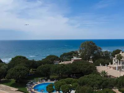 an aerial view of a resort with a swimming pool and the ocean at Oura Sunrise 16 Apartment by Stay ici Algarve Holiday Rental in Albufeira