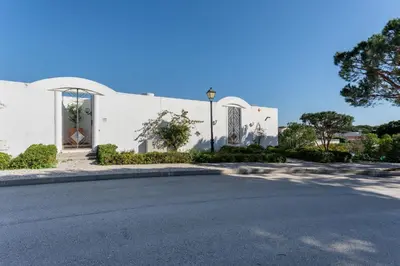 a white building with a street in front of it at Cozy 2 BDR W/Balcony in Vale do Lobo by LovelyStay in Vale do Lobo