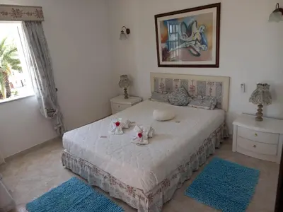 a house with a potted plant in a yard at Villa Belavista - Moradia para Famílias in Albufeira