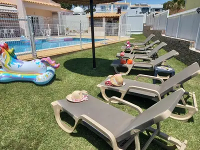 a bedroom with a bed with towels on it at Villa Belavista - Moradia para Famílias in Albufeira