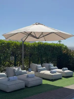 a villa with a pool and a table and chairs at Villa Amêndoa in Loulé