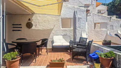 a patio with chairs and a table and a chair at APART ALDEIA DAS AÇOTEIAS - T0 - By BEDZY in Albufeira