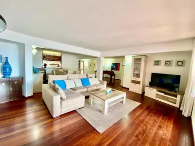 a living room with a couch and a tv at Marina Garden by Ethnic Ocean in Vilamoura