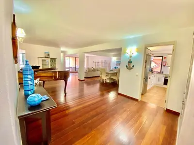 a living room with a piano and a dining room at Marina Garden by Ethnic Ocean in Vilamoura