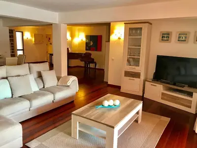 a living room with a couch and a table at Marina Garden by Ethnic Ocean in Vilamoura