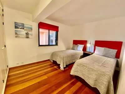 a room with two beds and a window at Marina Garden by Ethnic Ocean in Vilamoura