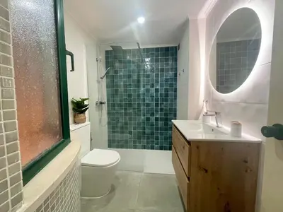 a bathroom with a toilet and a sink and a shower at Marina Garden by Ethnic Ocean in Vilamoura