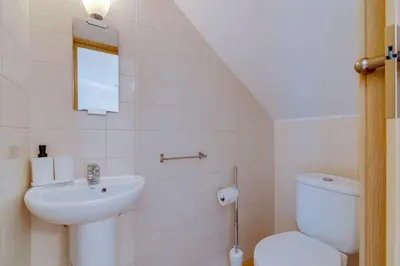 a staircase leading to a kitchen with a dining room at Collection beach side - Albufeira Oura praia 200 meters in Albufeira