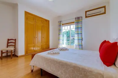 a bathroom with a sink and a tub and a mirror at Collection beach side - Albufeira Oura praia 200 meters in Albufeira