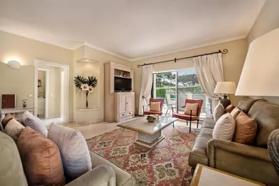 a living room with a couch and a table at Mng Elliott50 in Vale do Lobo