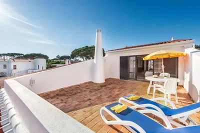 an aerial view of a house with a swimming pool at Mng Elliott24 in Vale do Lobo