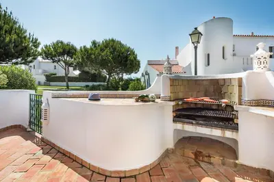 an aerial view of a white house with a yard at Mng Elliott13 in Vale do Lobo